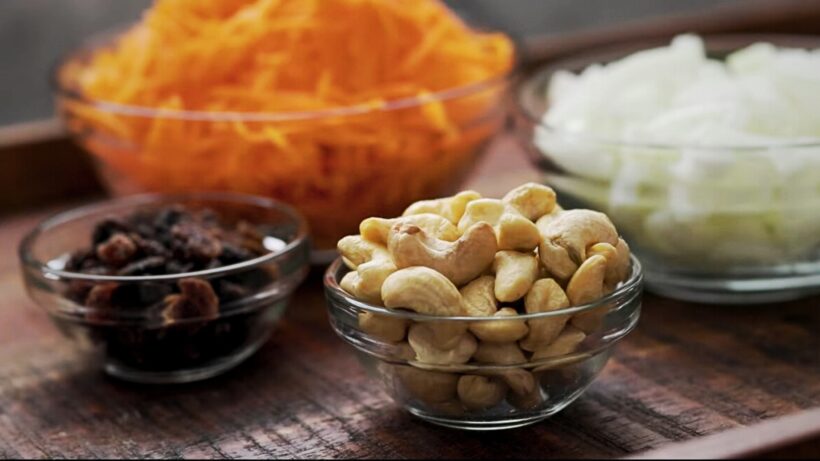Cashews, Raisins and Carrots. Concept for a Cashew Dish. Cashew Health Benefits