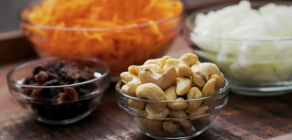 Cashews, Raisins and Carrots. Concept for a Cashew Dish. Cashew Health Benefits